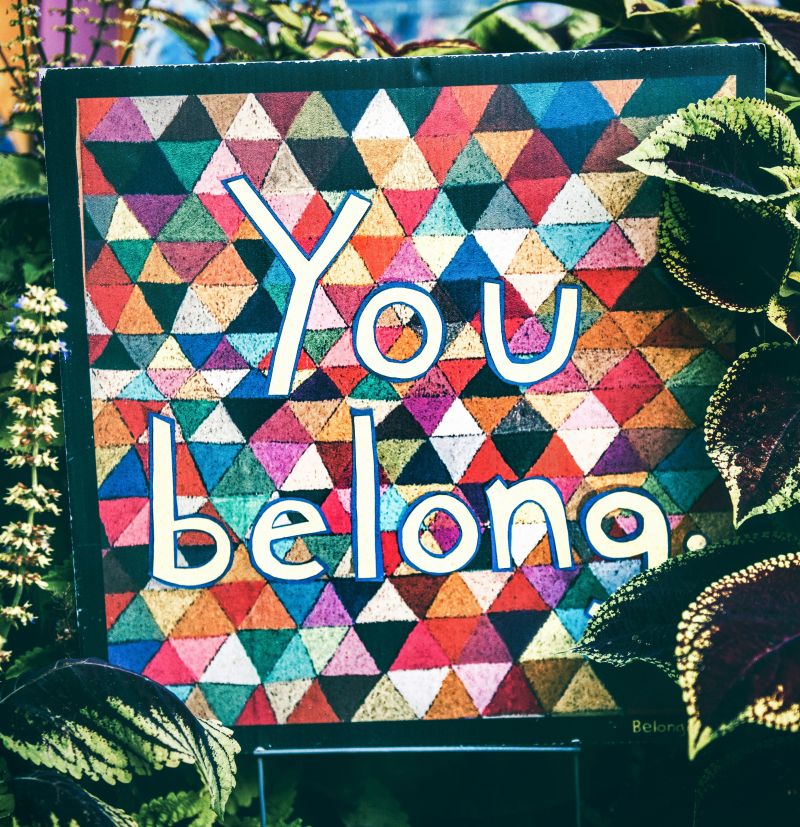 A quilted-looking sign that reads "You belong" by Tim Mossholder